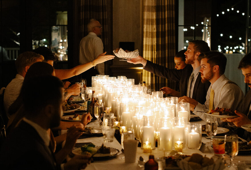 Guests sharing a candlelit holiday dinner at Kimpton Taconic Hotel